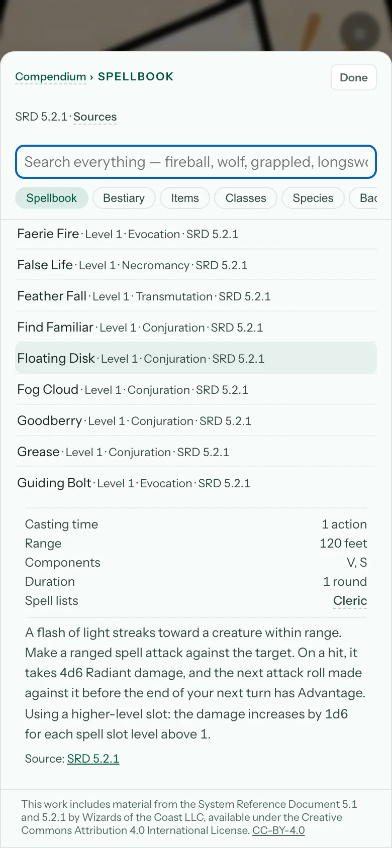 The compendium open on a spell: casting time, range, components, duration, the rule text, and a Source line pointing at the SRD page.